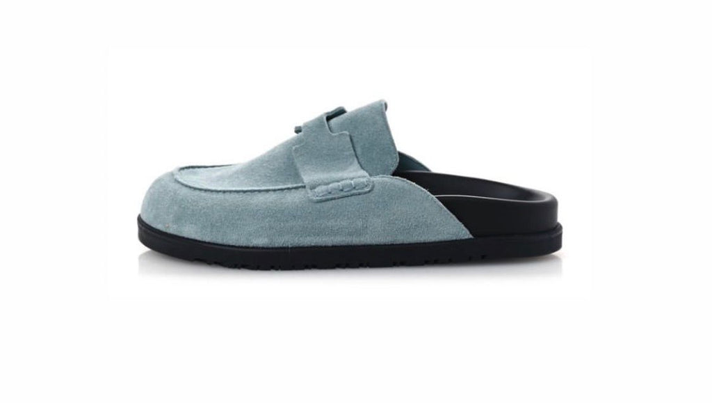 Hermès Go mules made of light blue suede calfskin.