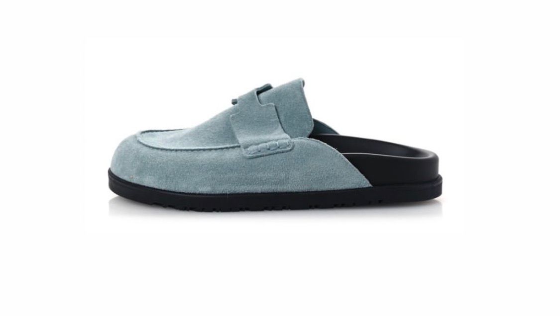 Hermès Go mules made of light blue suede calfskin.