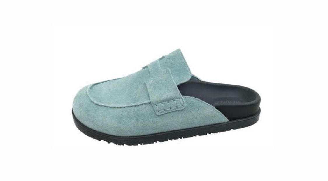 Hermès Go mules made of light blue suede calfskin.